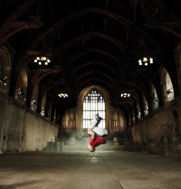 Photo of a street dancer in Westminster Hall as part of the somewhereto_ project in 'dream space'