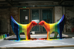 Two statues of the Superlambananas facing eachother