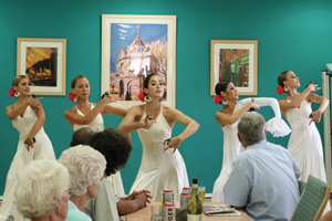 Spanish dancers, dancing infront of people sitting at a table
