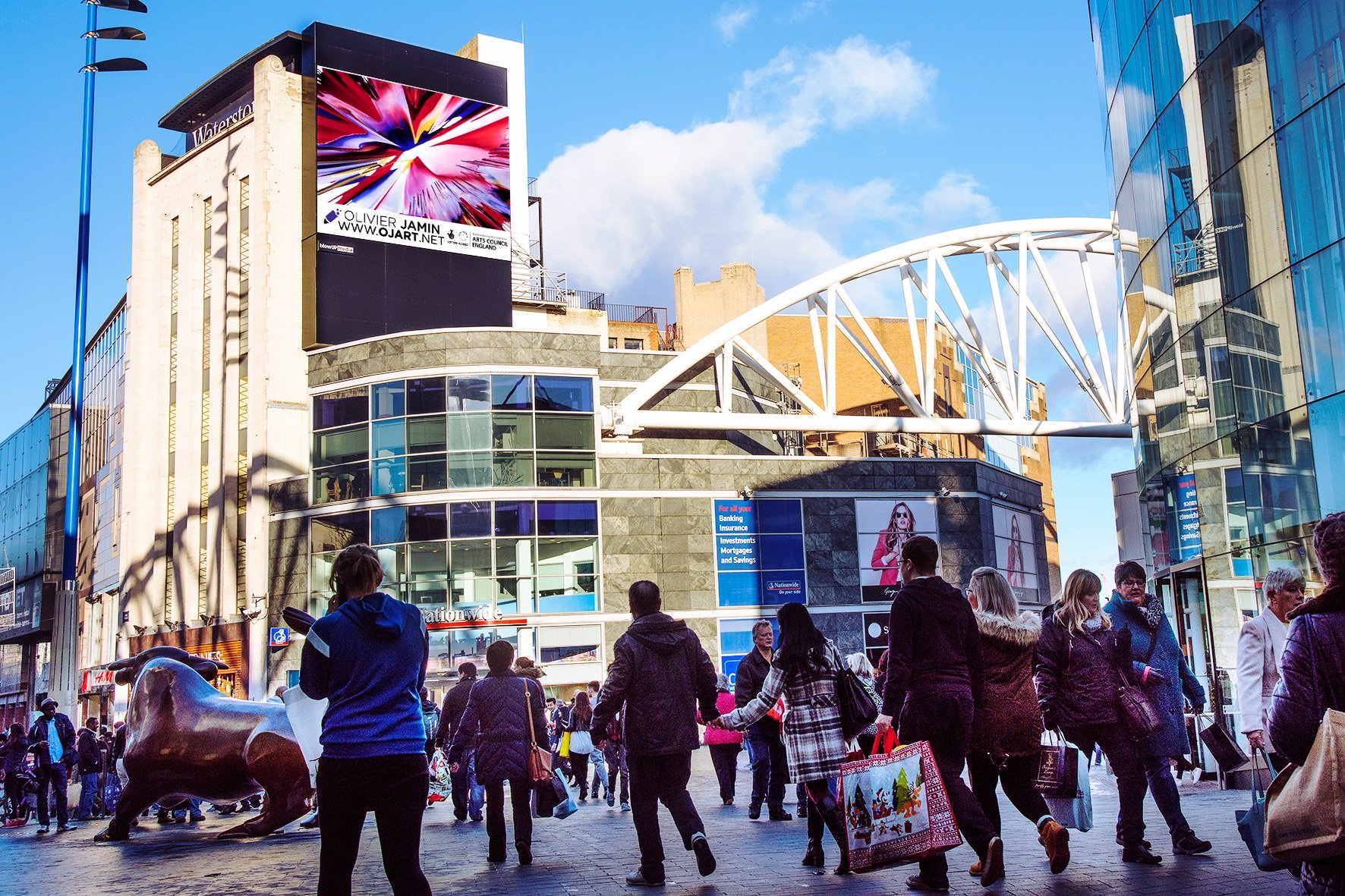 Photo of a full motion screen in Birmingham with Olivier's artwork on