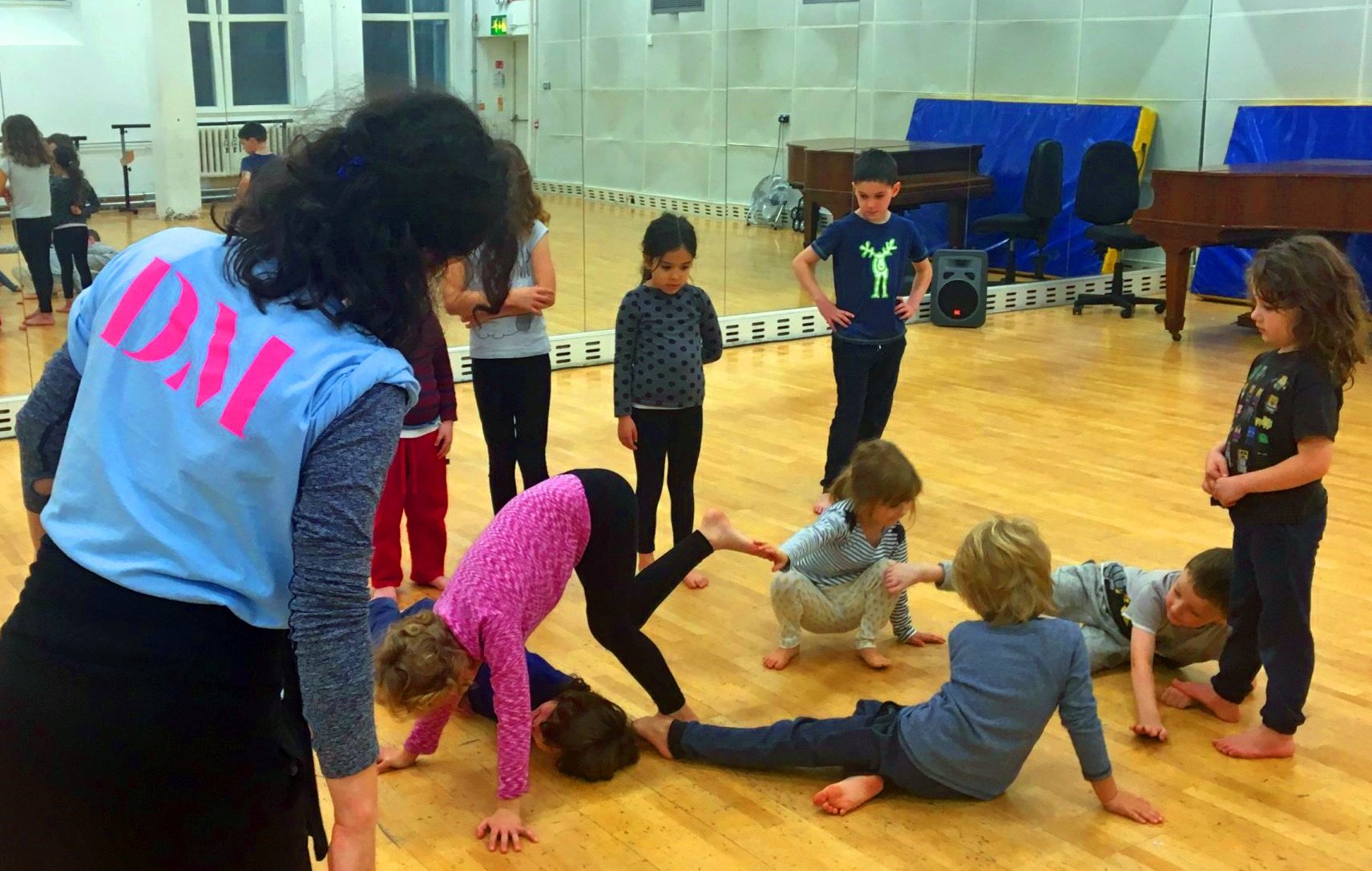 Photo of children in dance class with teacher