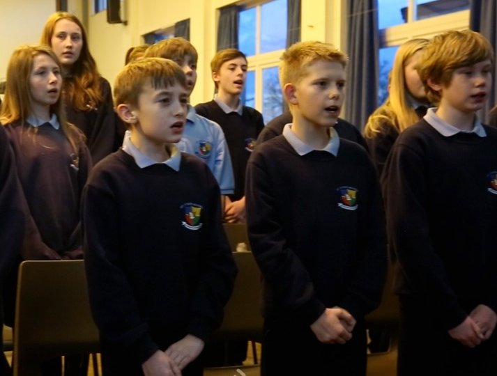Photo of school children singing
