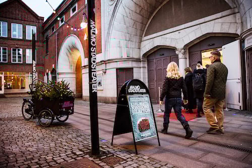 Photo of entrance to theatre with pedestrians