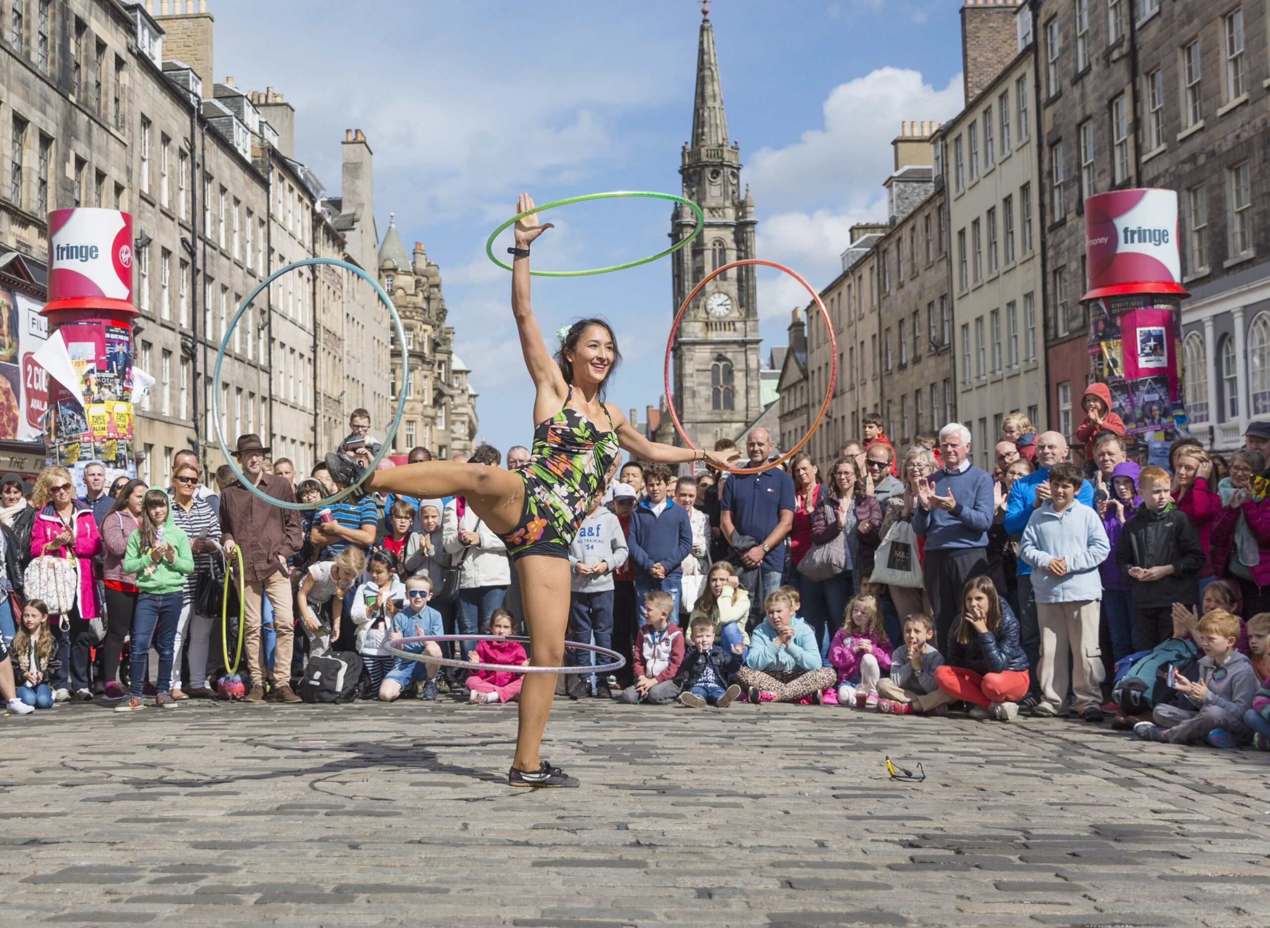 Photo of female performer with hoolahoops