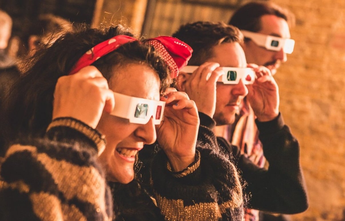 Photo of people wearing 3D glasses