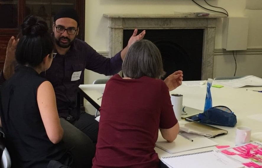 Three people working together