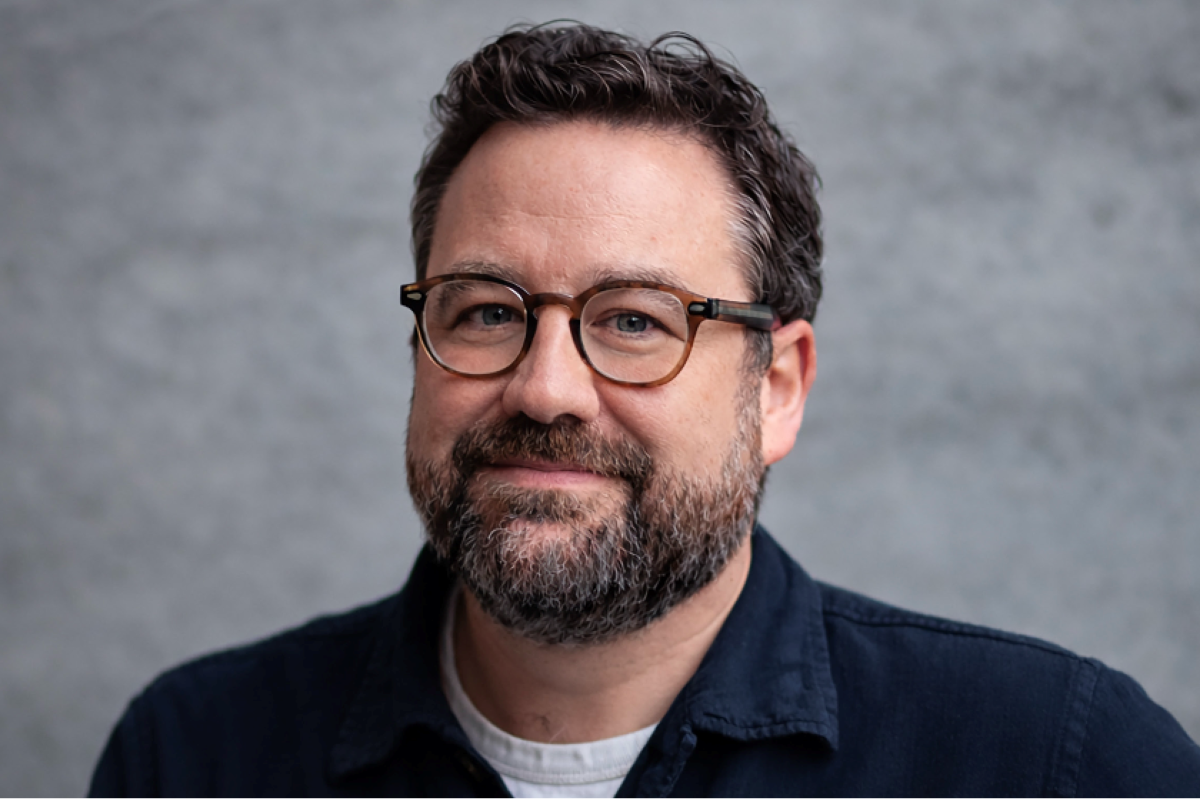 Headshot of Joe Hill in a dark shirt