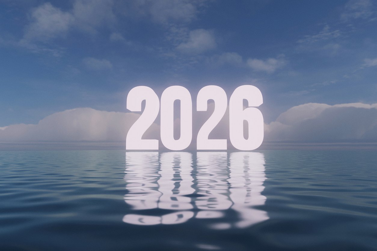 The year 2026 illuminated and reflected on calm, blue water. bright sky with soft, white clouds, conveying a hopeful and expansive future. Ideal for themes of optimism, fresh starts, and new beginning