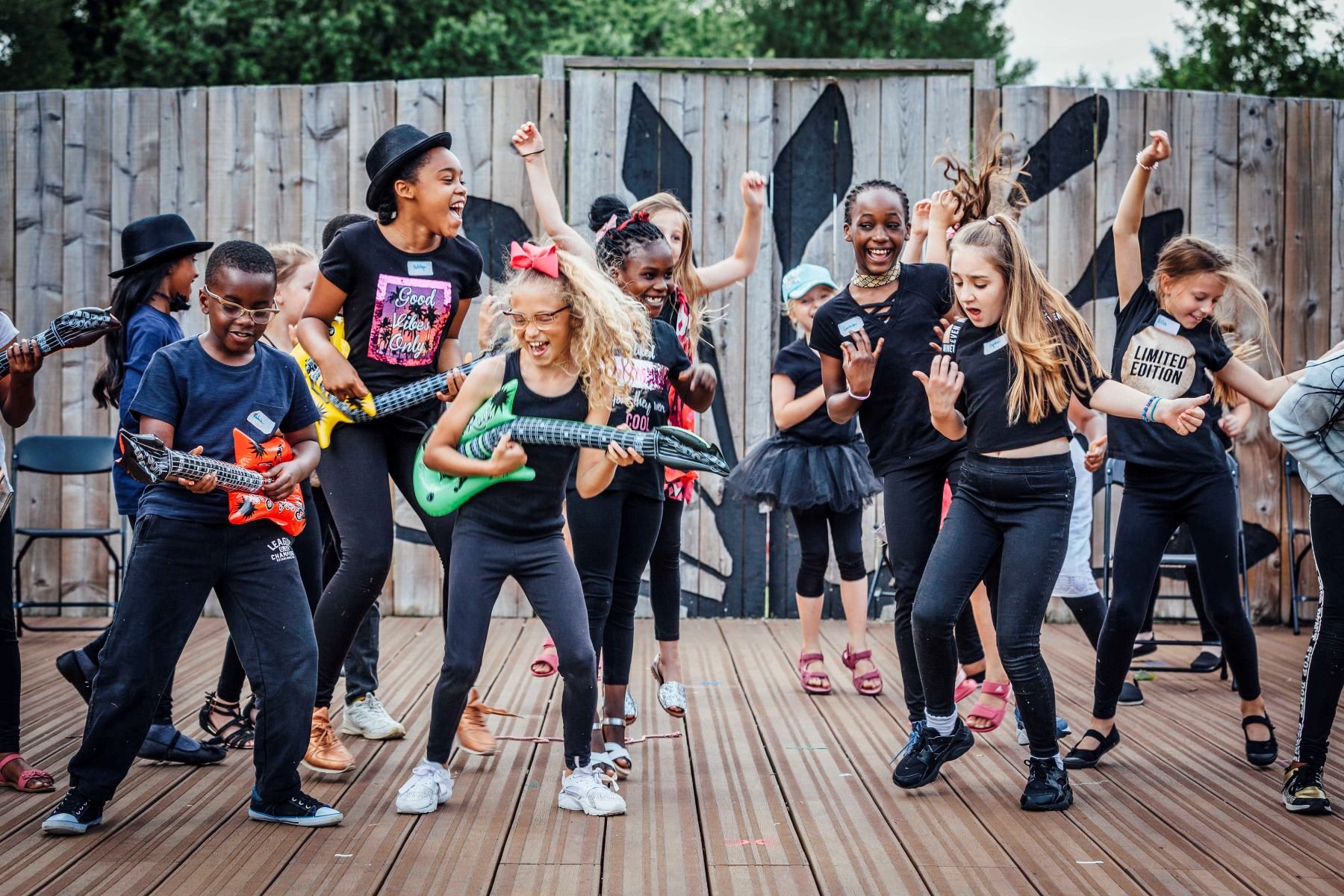 Young children performing outside