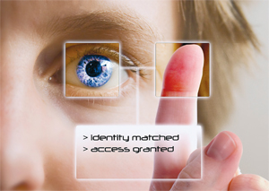 A person looks into a retina scanner and presses their finger tip to the screen, and is granted permission to access a system.