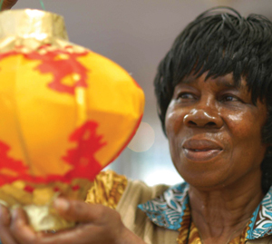 A lady plays with a chinese decoration