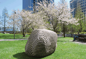 A grooved big rock on the grass in jubilee park