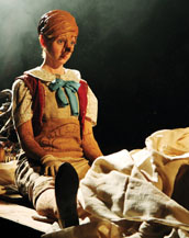 Photo of Tobacco Factory's Pinocchio sitting on floor