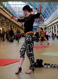 Photo of girl dancing in train-station like environment © PHOTO Richard Thomson