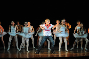 Billiot Elliot dancing on stage with ballerinas