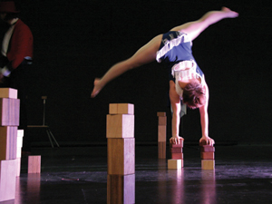 Gymnast hand standing on wooden blocks