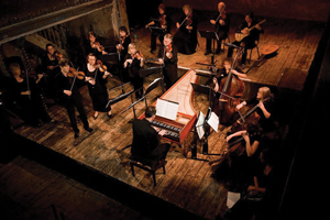 an orchestra on a wooden stage