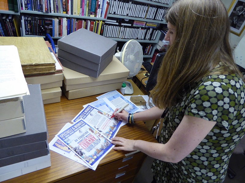 Angela Haighton, Head of the NFCA and Digital Preservation at the University of Sheffield Library, reviews proofs of the exhibition poster, leaflet and booklet. We work with a designer to create promotional material and have had a number of posters digitised. We have to ensure we have permission from copyright holders to use images of collection items.