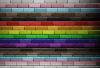 brick wall painted in colour of pride/LGBTQ flag colours