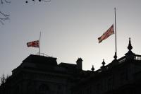 Union flags flying at half mast
