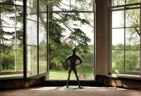 Photo of a Peter Pan statue in a window