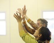 Photo of rehearsing hand movements at a dementia workshop
