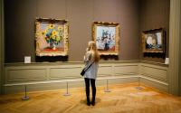 a woman visits an art gallery