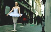 Photo of ballet dancer in grimy street