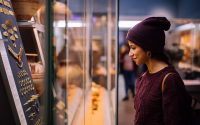 Woman looking at artefacts in the British Museum