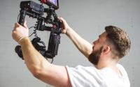 A film maker uses a video camera