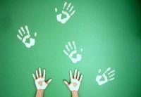 Photo of painted hands making hand prints