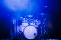 image of a drumkit on a music stage