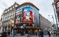 Shaftesbury Avenue in London, on the West End. The photo shows an advertisement for production Les Misérables