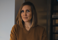 Johanna Agerman Ross, incoming Chief Curator, Design Museum. A woman with shoulder length, caramel-coloured hair matching her light-brown, V neck jumper and lipstick. She is slightly smiling.