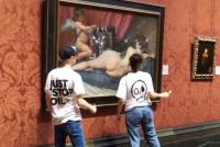 Protestors attacking a painting at the National Gallery