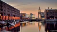 The river mersey on Liverpool Albert Dock at sunset, stock photo.
