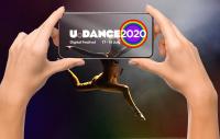image of a pair of hands taking a photo on a mobile phone of a dancer in mid air - the phone has the U.Dance 2020 logo in the foreground