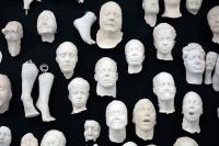 Moulds of heads and feet as part of an artwork