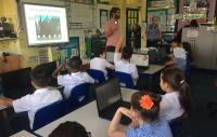 Photo of Julian Mitchell leading a coding activity at Raynham Primary School in London