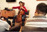 Photo of cellist performing for patients