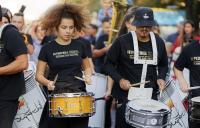 A photo of a group of young people playing percussion