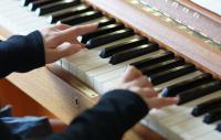 Photo of hands playing piano