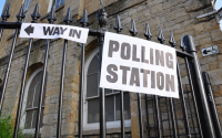 a signpost signalling a polling station