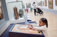 Young girl looking at a museum display