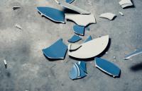 A photo of a smashed plate on the floor