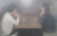 Blurry image of people talking