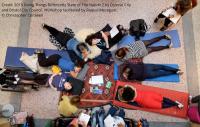 People laying on the floor working collaboratively