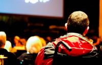 Photo of a person in a wheelchair at the theatre