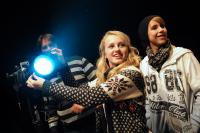 Photo of young people operating lighting