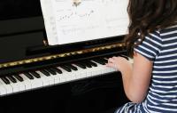 Photo of girl playing piano